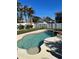 Inviting kidney-shaped pool with spa and lush landscaping at 1600 Pennsylvania Ne Ave, St Petersburg, FL 33703