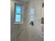 Shower with marble tile and a window for ventilation at 1600 Pennsylvania Ne Ave, St Petersburg, FL 33703