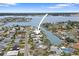 Aerial view showcasing home's canal-front position at 16015 Redington Dr, Redington Beach, FL 33708