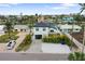 Aerial view of a modern home with a large yard at 16015 Redington Dr, Redington Beach, FL 33708