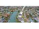 Aerial view of home situated on a canal with boats at 16015 Redington Dr, Redington Beach, FL 33708