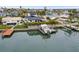 Waterfront property with boat lift and dock, offering scenic views at 16015 Redington Dr, Redington Beach, FL 33708