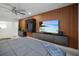 Main bedroom with a king-size bed and wood wall accents at 16015 Redington Dr, Redington Beach, FL 33708