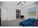 Serene bedroom with a walk-in closet and ceiling fan at 16015 Redington Dr, Redington Beach, FL 33708