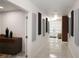 Long hallway with gray and black wall accents at 16015 Redington Dr, Redington Beach, FL 33708