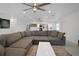 Spacious living room with sectional sofa and view of kitchen at 16015 Redington Dr, Redington Beach, FL 33708