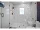 Large walk-in marble shower with glass enclosure at 16015 Redington Dr, Redington Beach, FL 33708