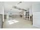 Under renovation living room with exposed walls and new flooring at 17602 Sterling Ter, Redington Shores, FL 33708