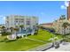 Aerial view of condo building with pool and oceanfront location at 17980 Gulf Blvd # 501, Redington Shores, FL 33708