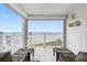 Spacious balcony overlooking the beach with comfortable seating at 17980 Gulf Blvd # 501, Redington Shores, FL 33708