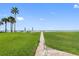 Pathway to beach with lush lawn and ocean views at 17980 Gulf Blvd # 501, Redington Shores, FL 33708