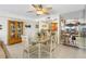 Dining area with glass table and four chairs, near kitchen at 17980 Gulf Blvd # 501, Redington Shores, FL 33708