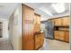 Well-equipped kitchen featuring ample wood cabinets and stainless steel fridge at 17980 Gulf Blvd # 501, Redington Shores, FL 33708