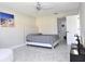 Spacious bedroom with ceiling fan and striped bedding at 19029 Us Highway 19 N # 6-16, Clearwater, FL 33764