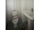 Small bathroom with pedestal sink and patterned floor at 2123 1St N Ave, St Petersburg, FL 33713