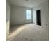 Spacious bedroom with large window and closet at 2123 1St N Ave, St Petersburg, FL 33713