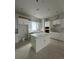 Spacious kitchen with white cabinetry and center island at 2123 1St N Ave, St Petersburg, FL 33713