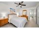 Serene bedroom with ceiling fan and ensuite bathroom access at 2256 Philippine Dr # 18, Clearwater, FL 33763