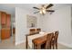 Dining area with wooden table and chairs, adjacent to kitchen at 2256 Philippine Dr # 18, Clearwater, FL 33763