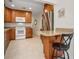 Well-equipped kitchen with wood cabinets and granite counters at 2256 Philippine Dr # 18, Clearwater, FL 33763