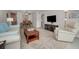 Bright living room features comfortable seating and a large TV at 2256 Philippine Dr # 18, Clearwater, FL 33763