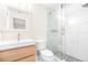 Updated bathroom with a modern vanity, toilet and a frameless glass shower at 2547 Lexington Oak Dr, Brandon, FL 33511