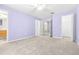 Spacious bedroom with light purple walls and en-suite bathroom at 2547 Lexington Oak Dr, Brandon, FL 33511