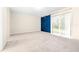 Bedroom with sliding glass door, blue barn door, and backyard view at 2547 Lexington Oak Dr, Brandon, FL 33511