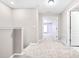 Spacious hallway with carpeted floors leading to bedrooms at 2547 Lexington Oak Dr, Brandon, FL 33511