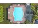 Community pool with surrounding brick patio and lounge chairs at 2547 Lexington Oak Dr, Brandon, FL 33511