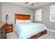 Spacious main bedroom with a king-size bed and wooden dresser at 2564 89Th Street E Cir, Palmetto, FL 34221