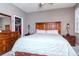 Serene main bedroom features a king-size bed, ample closet space, and a calming color scheme at 2564 89Th Street E Cir, Palmetto, FL 34221