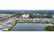 Aerial view of houses and lake in new community at 2667 89Th Street E Cir, Palmetto, FL 34221