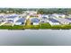 Aerial view of lakefront houses with fenced yards at 2667 89Th Street E Cir, Palmetto, FL 34221