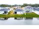 Aerial view of house with screened lanai overlooking lake at 2667 89Th Street E Cir, Palmetto, FL 34221