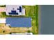 Aerial view of house and backyard next to lake at 2667 89Th Street E Cir, Palmetto, FL 34221