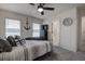 Bedroom with queen bed, gray carpet, and view of water at 2667 89Th Street E Cir, Palmetto, FL 34221