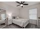 Bedroom with white metal bed frame and ceiling fan at 2667 89Th Street E Cir, Palmetto, FL 34221