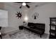 Cozy bedroom with black futon and gray area rug at 2667 89Th Street E Cir, Palmetto, FL 34221