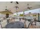 Relaxing community pool area with tables and seating under covered pavilion at 2667 89Th Street E Cir, Palmetto, FL 34221