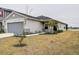 House exterior with palm trees and walkway leading to entrance at 2667 89Th Street E Cir, Palmetto, FL 34221