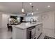 Kitchen island with white quartz countertop, sink, and dishwasher at 2667 89Th Street E Cir, Palmetto, FL 34221