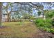 Large backyard with mature trees and lush landscape at 2819 50Th S St, Gulfport, FL 33707