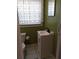 Small bathroom with pedestal sink and tiled floor at 2819 50Th S St, Gulfport, FL 33707