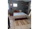 Comfortable bedroom with a king-size bed and rugs at 2819 50Th S St, Gulfport, FL 33707