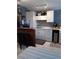 Small kitchen features a breakfast bar and white cabinets at 2819 50Th S St, Gulfport, FL 33707