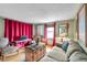 Living room with hardwood floors and red curtains at 2819 50Th S St, Gulfport, FL 33707