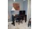 Home office features a writing desk and floor lamp at 2819 50Th S St, Gulfport, FL 33707