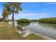 Relaxing waterfront view with bench, lush landscaping, and calm waters at 2900 45Th S St # 22, Gulfport, FL 33711