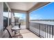 Screened balcony overlooking a lake and community at 3071 Marine Grass Dr, Wimauma, FL 33598